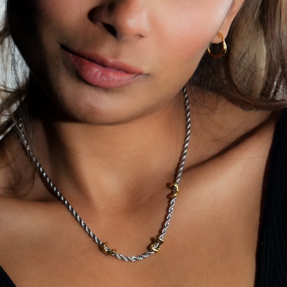 COSMINA Mixed Metals: Silver Rope Chain Necklace with Triple Mini Gold Criss-Cross Charms