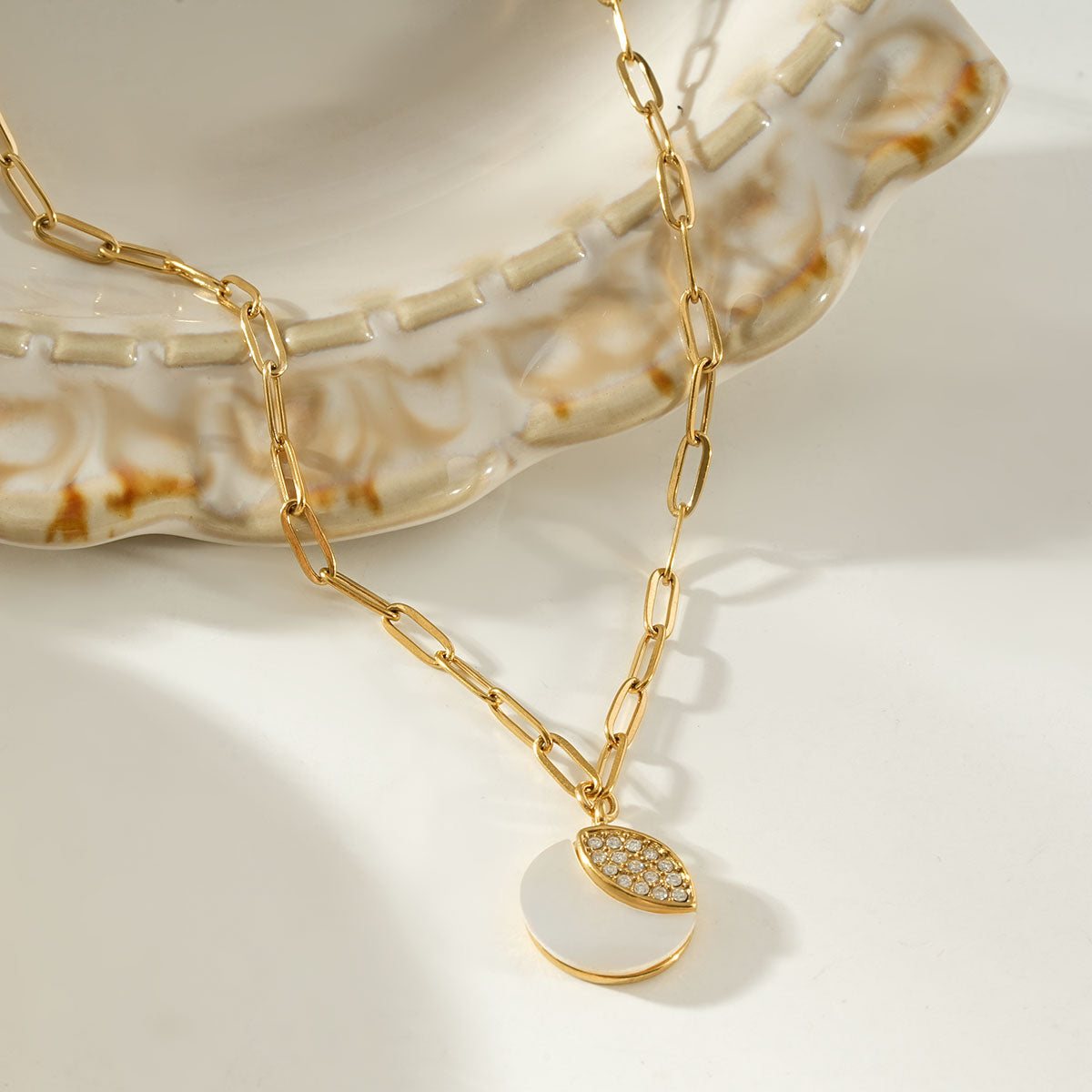 MOGGNA Gold: Coastal Shell Charm Necklace with Oval-Cut Zirconia Inlay