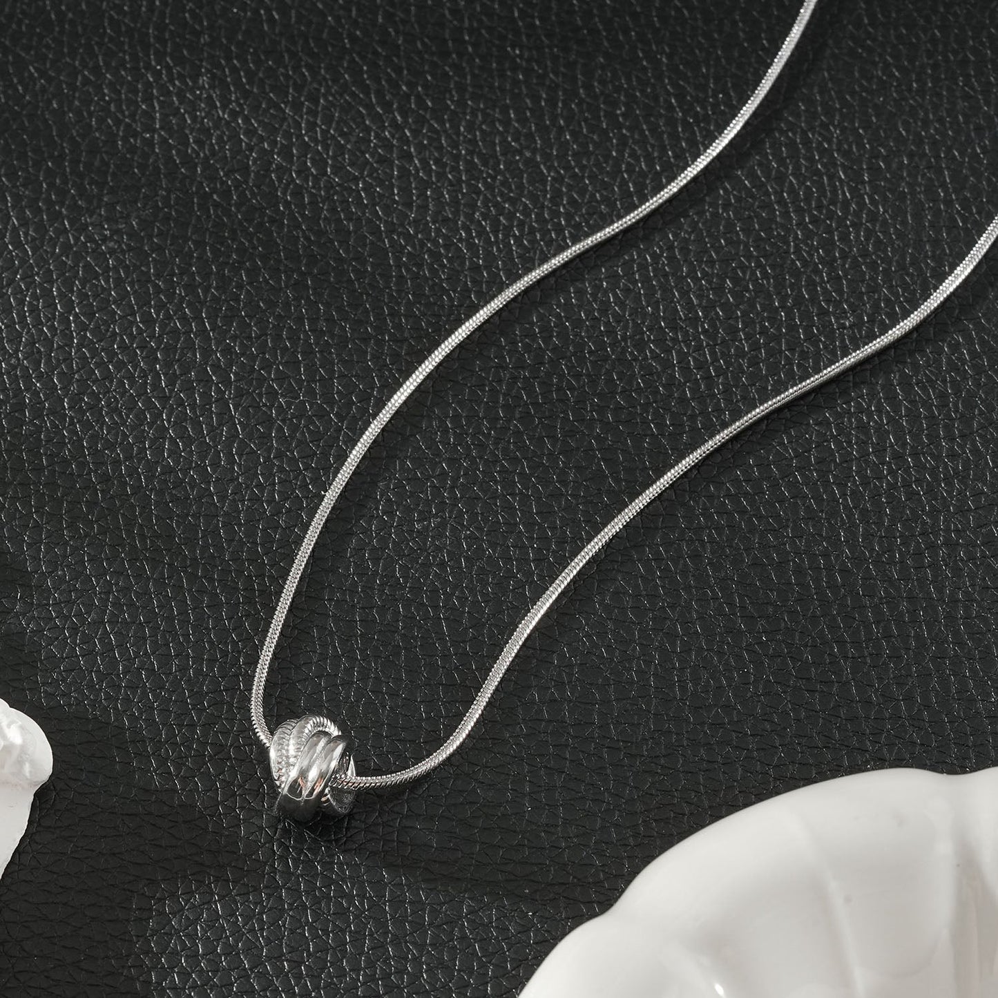 ALEKI Silver (White Gold): Sculptural Knot Pendant Necklace
