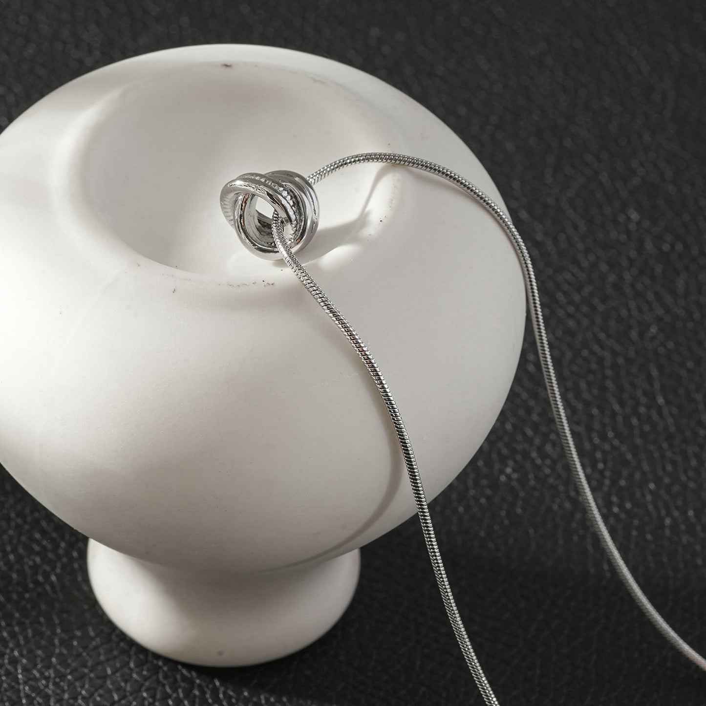 ALEKI Silver (White Gold): Sculptural Knot Pendant Necklace
