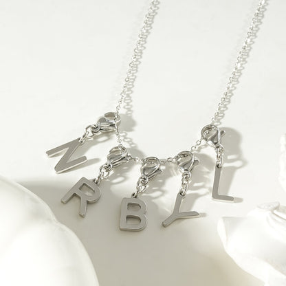 SOLID LETTER MINI CHARMS A–Z in SILVER (White Gold): Dainty Initial Alphabet Pendant for Necklaces & Bracelets — $12.50
