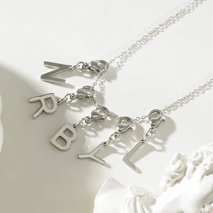 SOLID LETTER MINI CHARMS A–Z in SILVER (White Gold): Dainty Initial Alphabet Pendant for Necklaces & Bracelets — $12.50