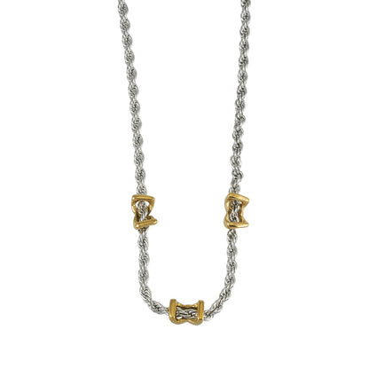 COSMINA Mixed Metals: Silver Rope Chain Necklace with Triple Mini Gold Criss-Cross Charms