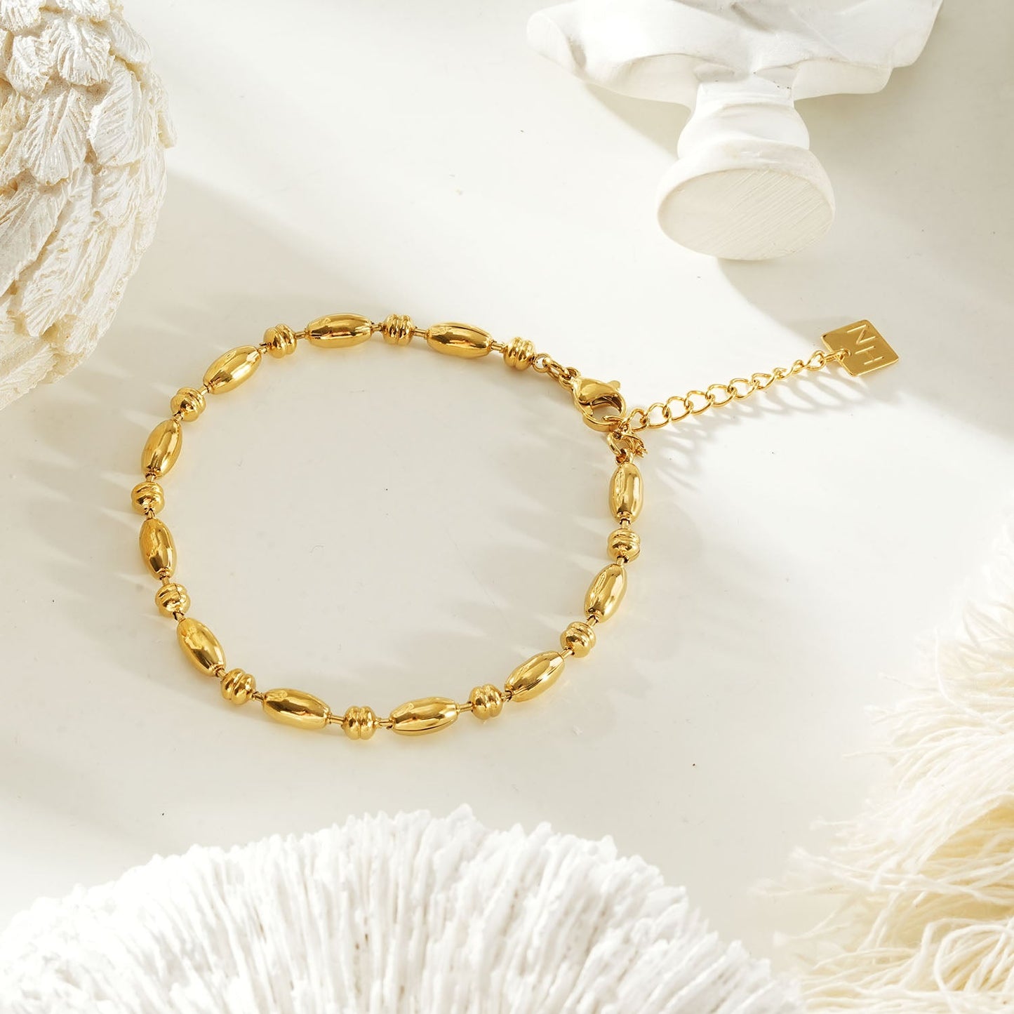 ADIATA Gold: Polished Oval Bead Bracelet – Sculpted Statement Jewellery