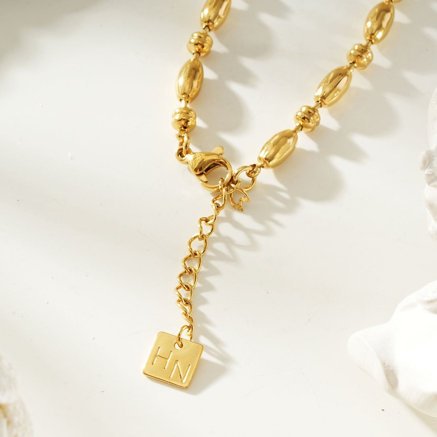 ADIATA Gold: Polished Oval Bead Bracelet – Sculpted Statement Jewellery