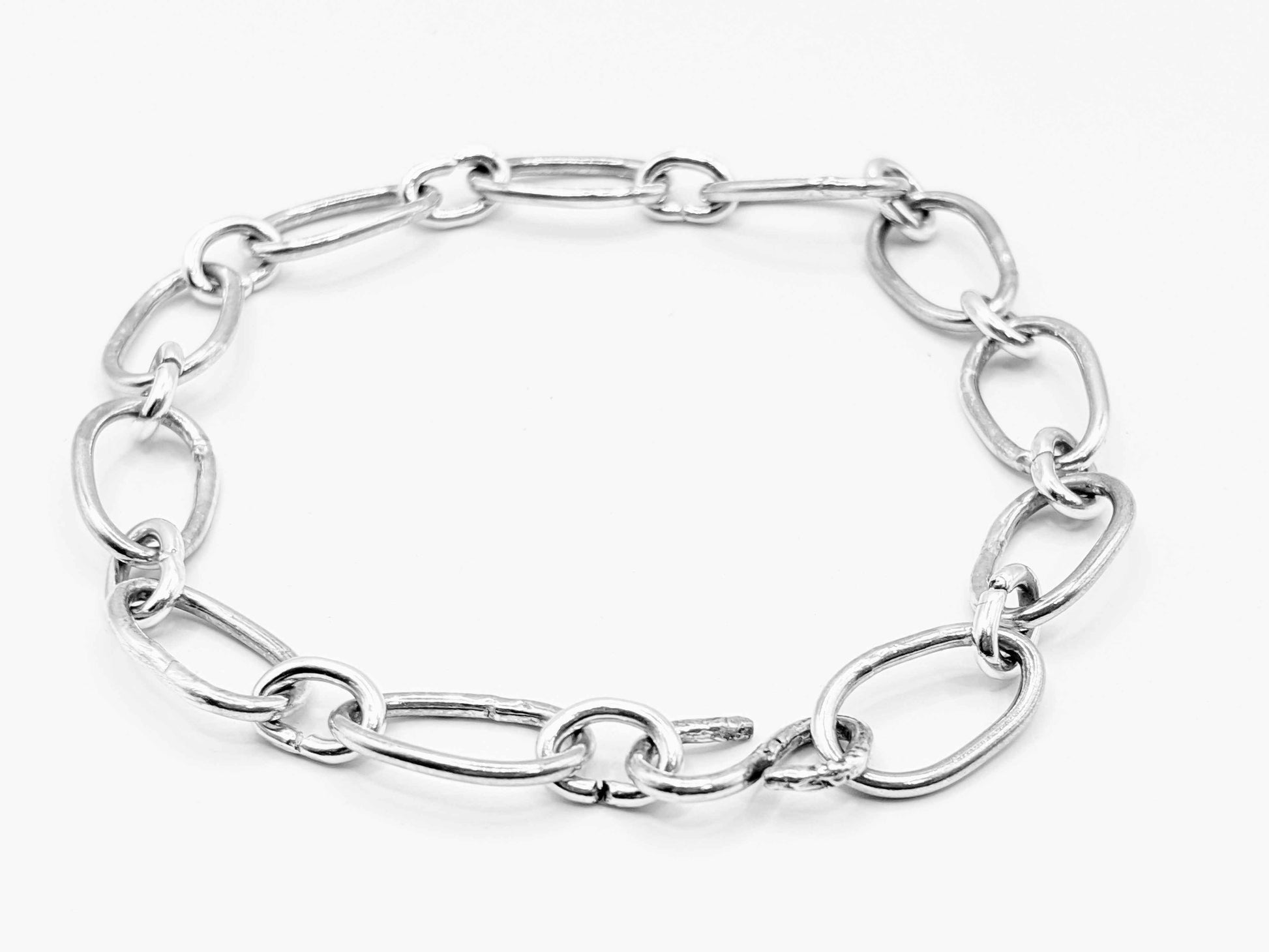 Radiant Linkage: Handcrafted Sterling Silver Oval Chain Bracelet